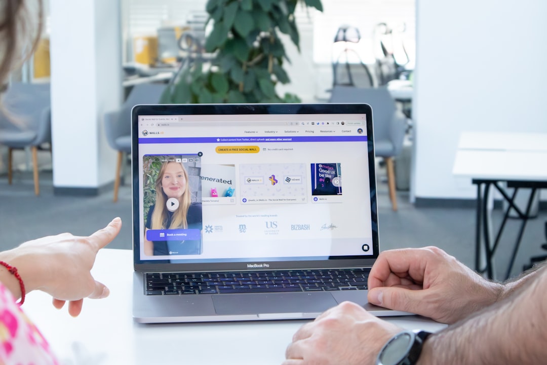 developer presenting project portfolio on laptop screen to interviewer