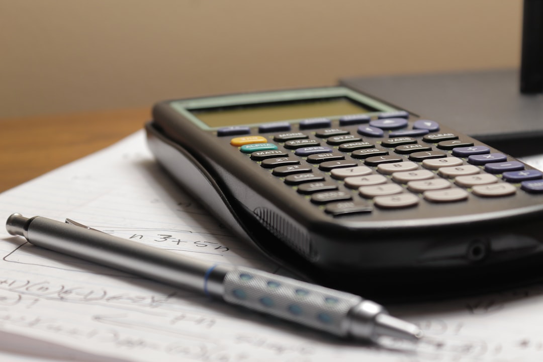 budget spreadsheet calculator notebook on table